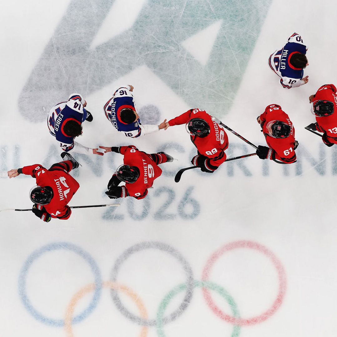 The U.S. men's team shakes hands with Canada's squad after winning the country's first gold medal in hockey in 46 years. | Jared C. Tilton/Getty Images