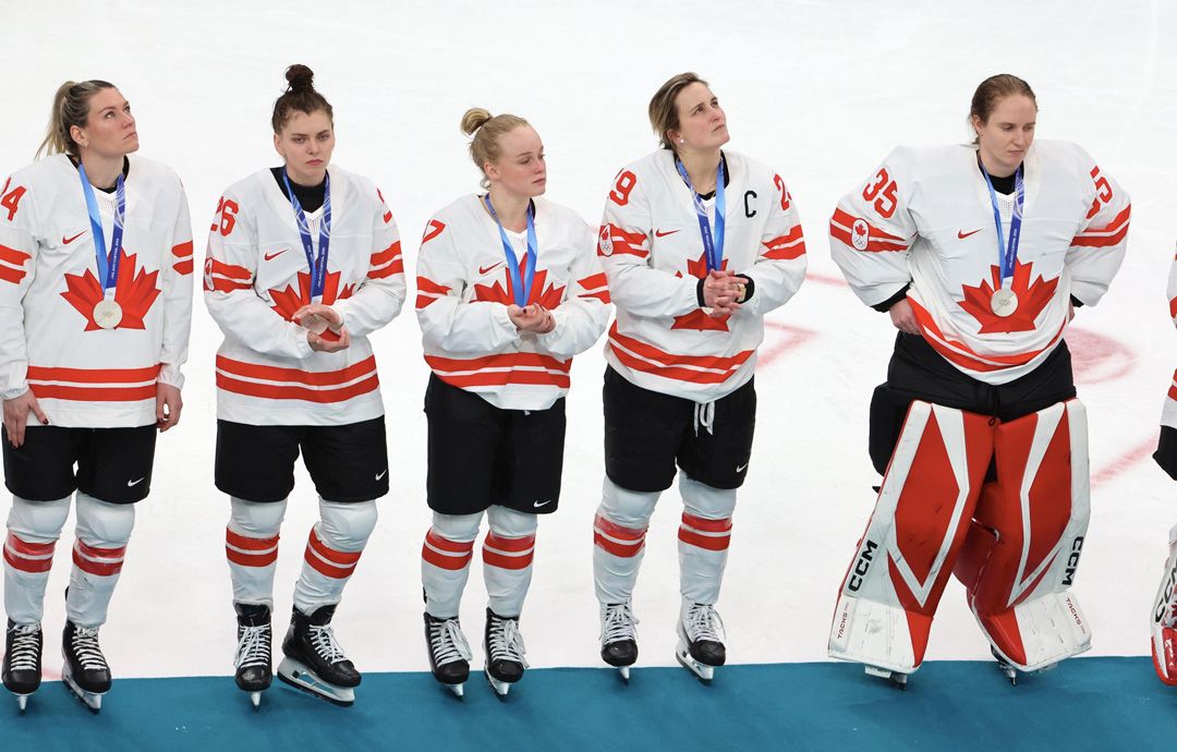 Canadian women's captain Marie-Philip Poulin (second from right) ponders what could have been during the silver medal presentation. | Xavier Laine/Getty Images