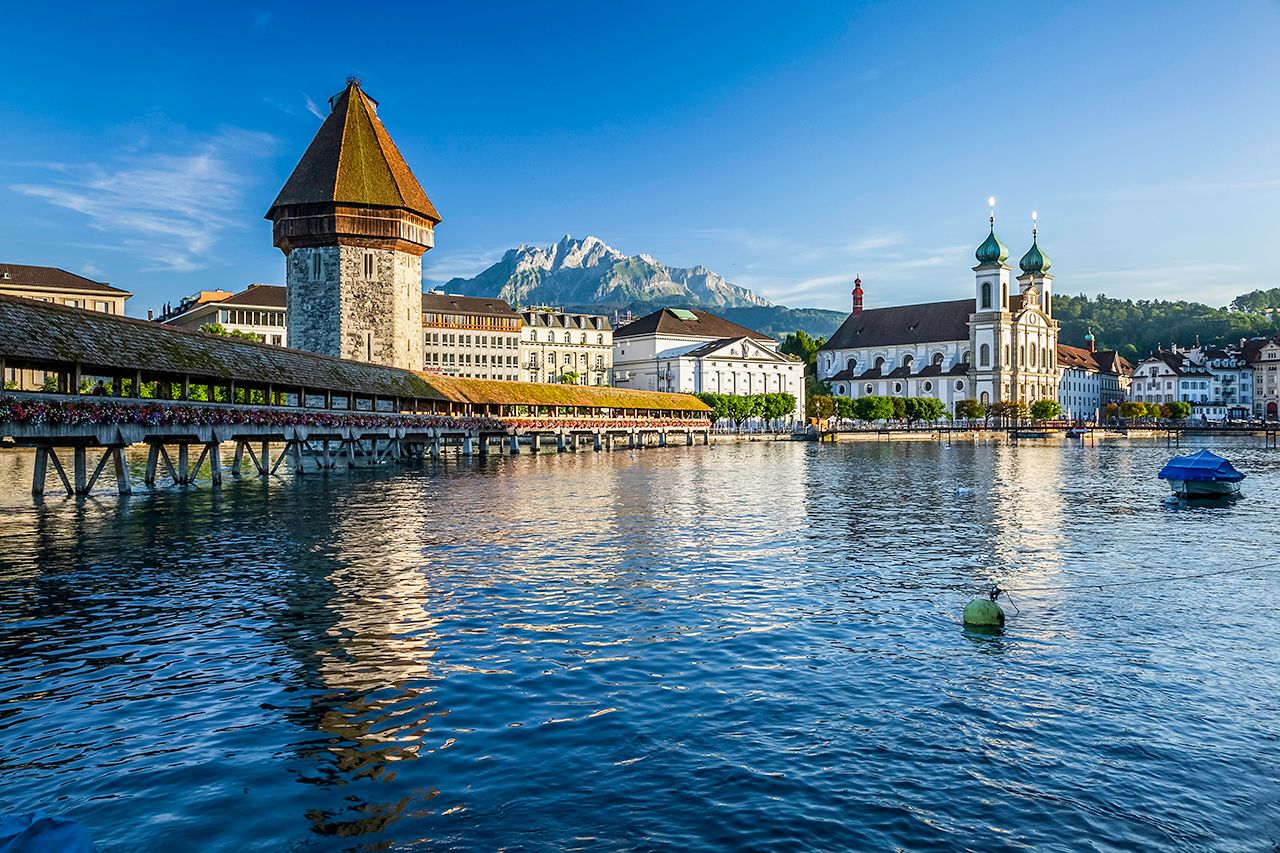 Lucerne has one of the world's oldest covered wooden bridges, which contains a number of interior paintings dating back to the 17th century. | Sasipa Muennuch / Getty Images