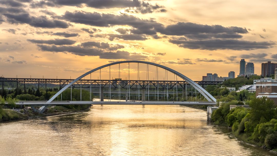 Edmonton city scape with Walter Dale Bridge, North Saskatchewan river and the sun behind clouds. | vadimgouida/Getty Images